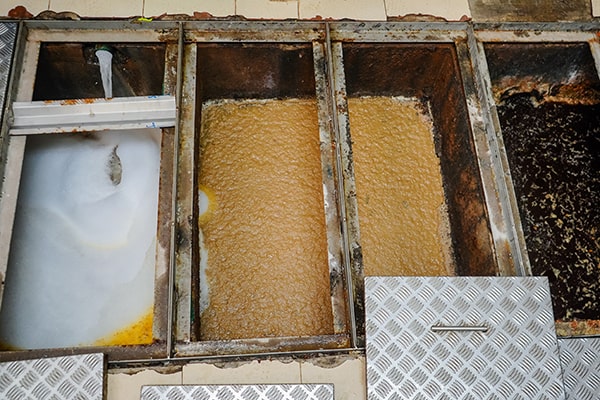 neglecting grease trap maintenance can lead to clogs, foul odors, and even plumbing backups, so it's important to stay on top of regular maintenance